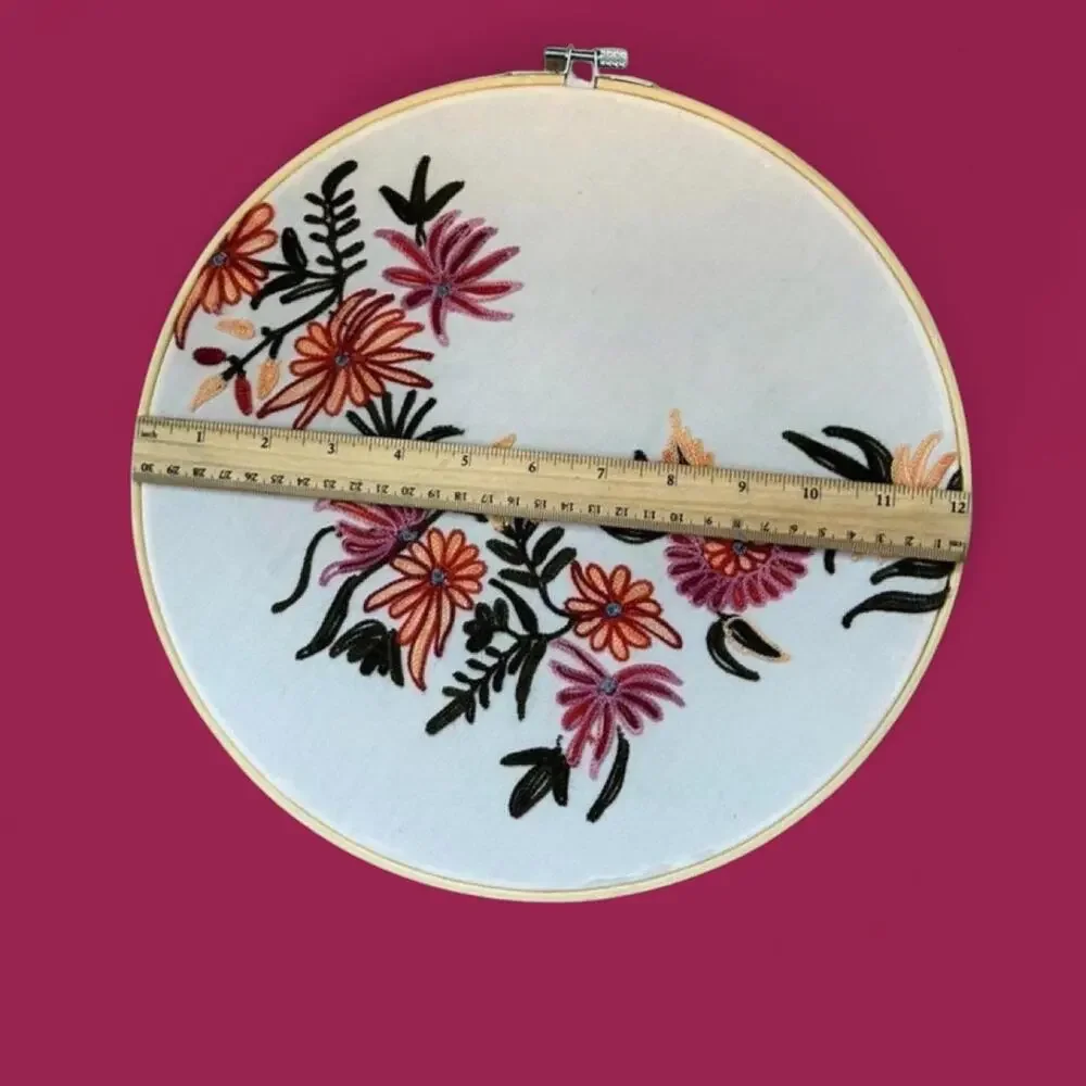Set of two matching floral embroidered bamboo hoop art. 12” and 10.5”.